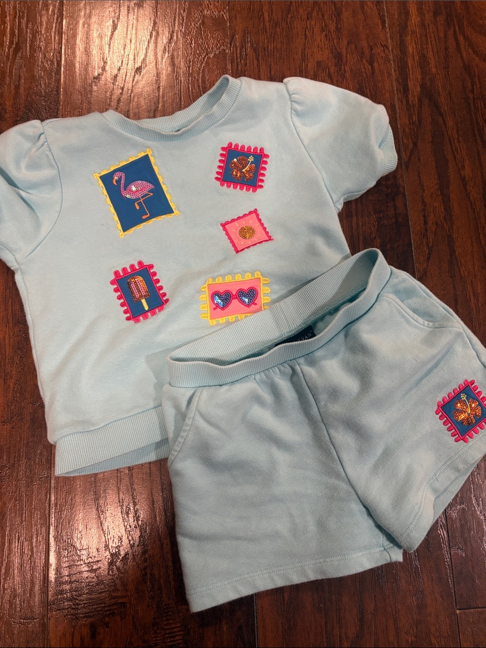 Andy & Evan Light Blue Patch Appliqué Top with Pink and Yellow Accents Girls 6x